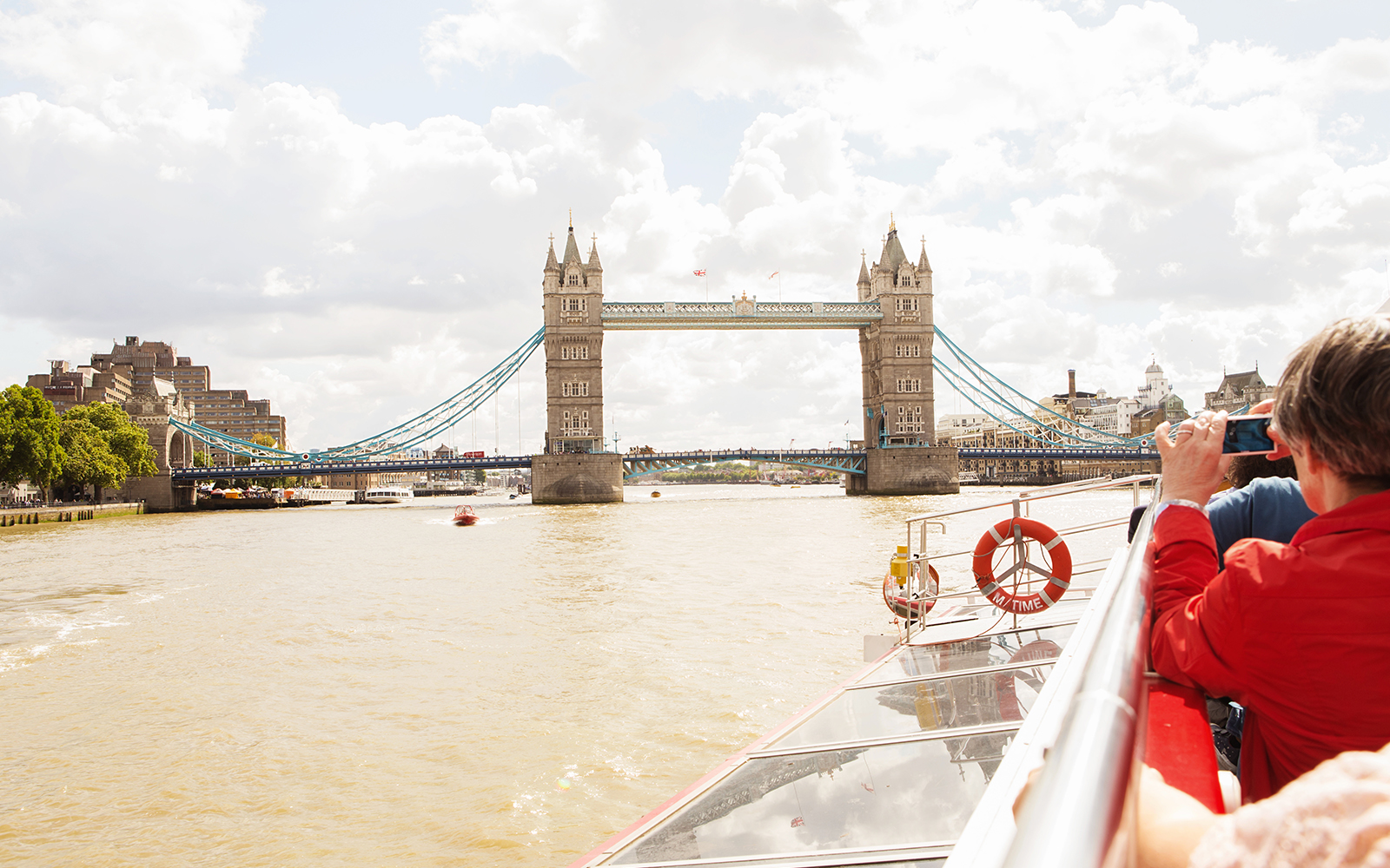 Westminster Pier with boats docked for Thames River cruise in London.